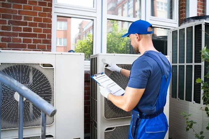 Technician completing an equipment inspection checklist
